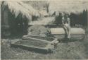 Bontoc Igorot man with pine coffins