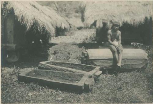 Bontoc Igorot man with pine coffins