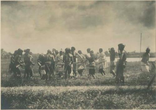 Group of Igorot people performing traditional Bontoc head dance