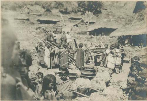 Group of Igorot people performing rice threshing ceremony