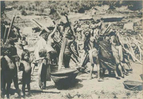 Group of Igorot people performing rice threshing ceremony