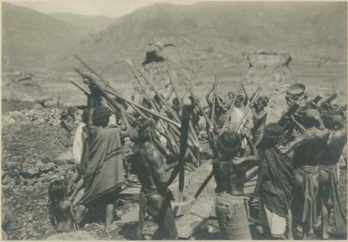 Group of Igorot people performing rice threshing ceremony