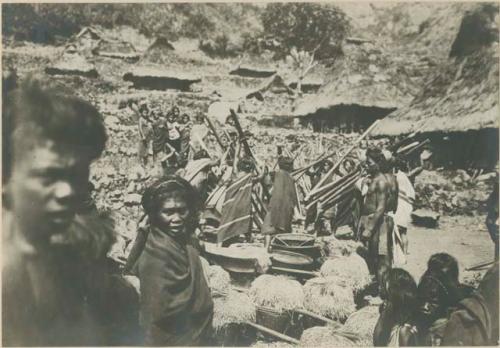 Group of Igorot people performing rice threshing ceremony