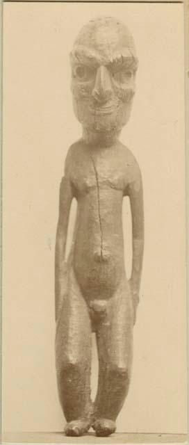 Carved wooden male figure, front