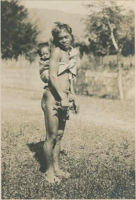 Bontoc Igorot man who is a baby tender