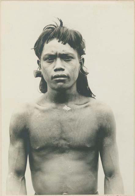 Bontoc Igorot man with wood ear ornament