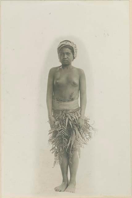 Bontoc Igorot woman wearing leaf covering for work