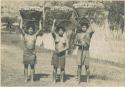 Igorot women carrying baskets of camotes