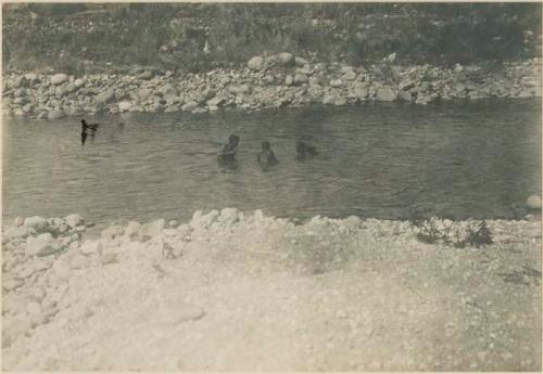 Group of Igorot people fishing in river near Bontoc