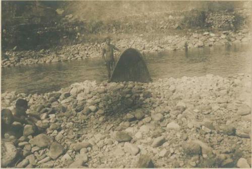 Group of Igorot people fishing in river near Bontoc