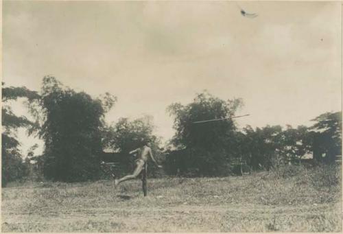 Igorot warrior throwing spear