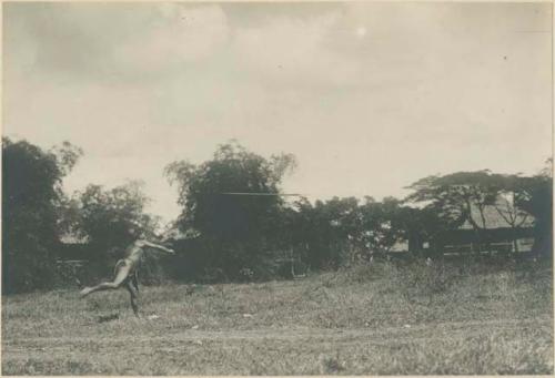 Igorot warrior throwing spear