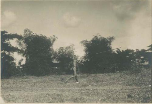 Igorot warrior throwing spear