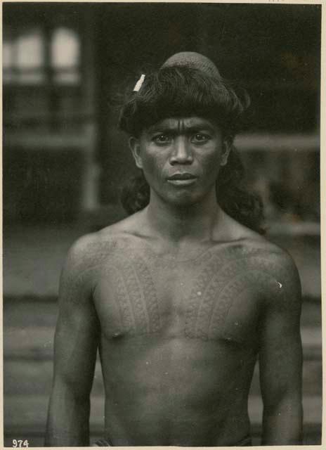 Man with tattooed shoulders