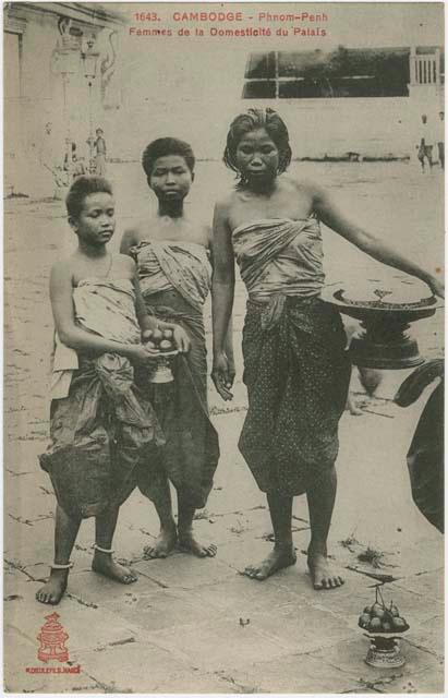 Women holding platters of food