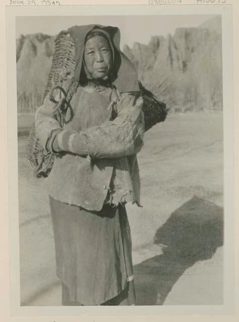 Woman carrying basket on her back