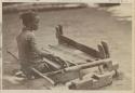 Young woman using loom