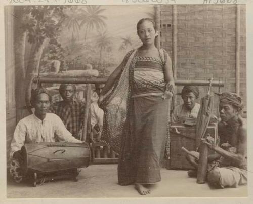 Girl dancing in front of band