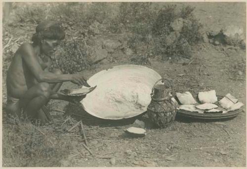 Bontoc Igorot man making salt cakes