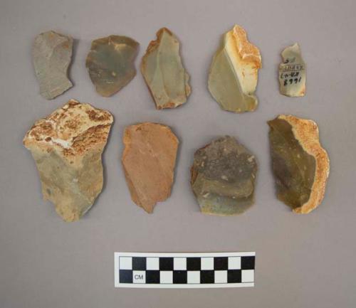 19 flint flakes, including cream, grey, brown and reddish brown colored stone (some with cortex)