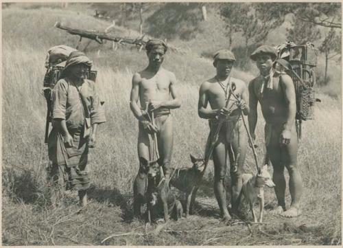 Igorot men with dogs