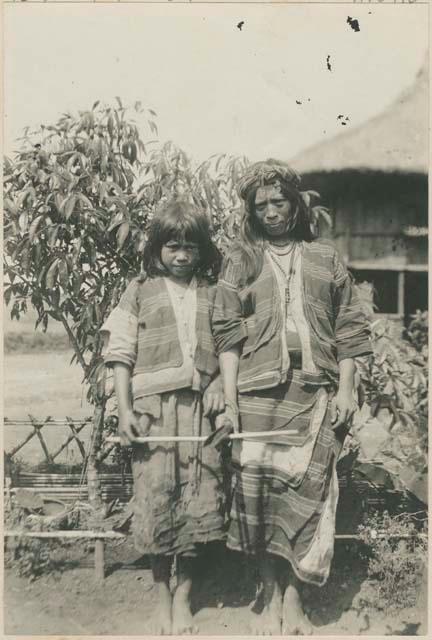 Two Igorot women, at Baguio, Benguet, standing