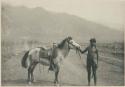Bontoc Igorot man with his saddle pony