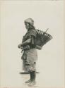 Benguet Igorot woman with basket on her back, profile