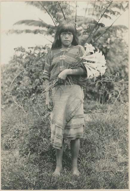 Geenai carrying a bunch of Benguet lillies