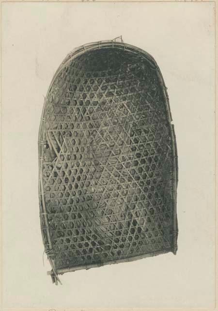 Rain shield of palm leaves and rattan