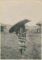Geenai wearing rain shield