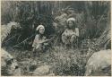 Two Igorot women sitting on river bank