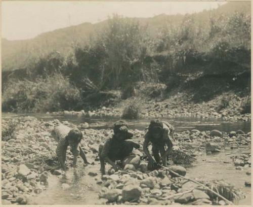 Igorot children fishing in the stream at Trinidad