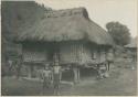 Igorot children in front of house