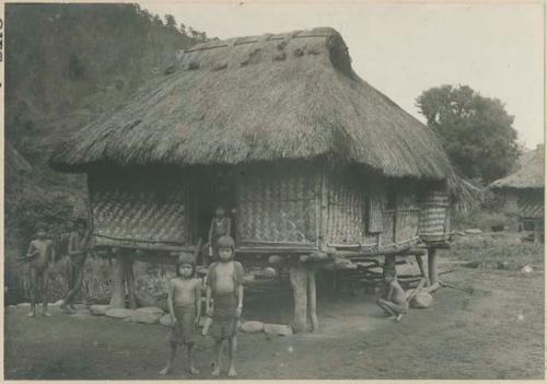 Igorot children in front of house
