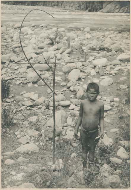 Igorot boy with snare for catching birds