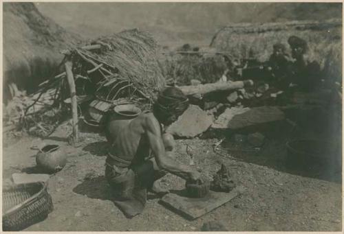 Igorot woman sculpting clay pot