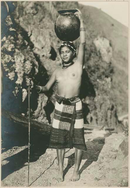 Igorot woman with finished pot to sell