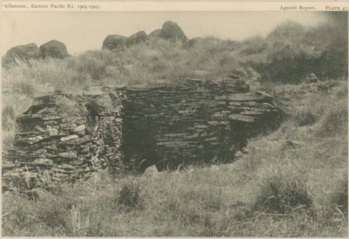 Stone houses, with sculptured rocks in background