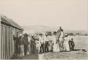 Group of people in village at Cook Bay