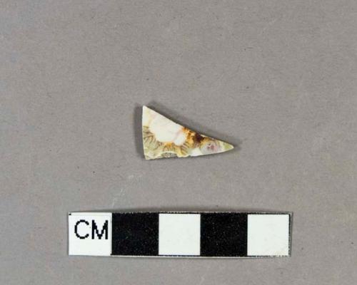 Polychrome hand painted whiteware body sherd with floral design