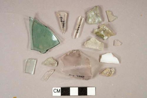 1 milk glass vessel fragment, 4 colorless vessel glass fragments, 7 aqua vessel glass fragments, 1 light amethyst vessel glass fragment