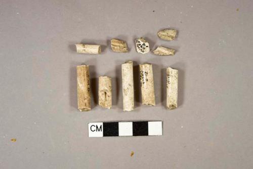 White undecorated kaolin pipe fragments, 1 bowl fragment, 9 stem fragments, 3 with 5/64" bore diameter, 2 with 6/64" bore diameter, 1 with 7/64" bore diameter