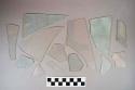 16 colorless flat glass fragments, 47 light aqua flat glass fragments