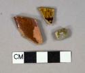 Brown slip glazed earthenware vessel body fragments, 1 vessel rim fragment, 2 with red paste, 1 with gray paste