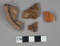 Brown slip glazed redware vessel fragments, 2 base fragments mended, 3 body fragments, undecorated