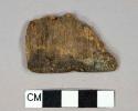 Wood fragment, possible remnants of paint or label