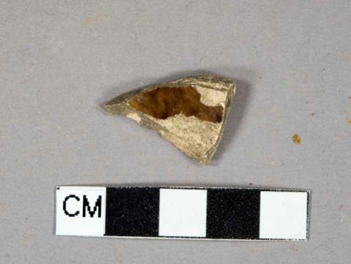 brown slip glazed earthenware vessel body fragment, buff paste, undecorated, likely rockingham ware