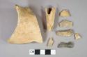 Bone fragments, 1 fragment heavily burned, largest fragment has evidence of butchery