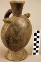 Black pottery jar, handle on side